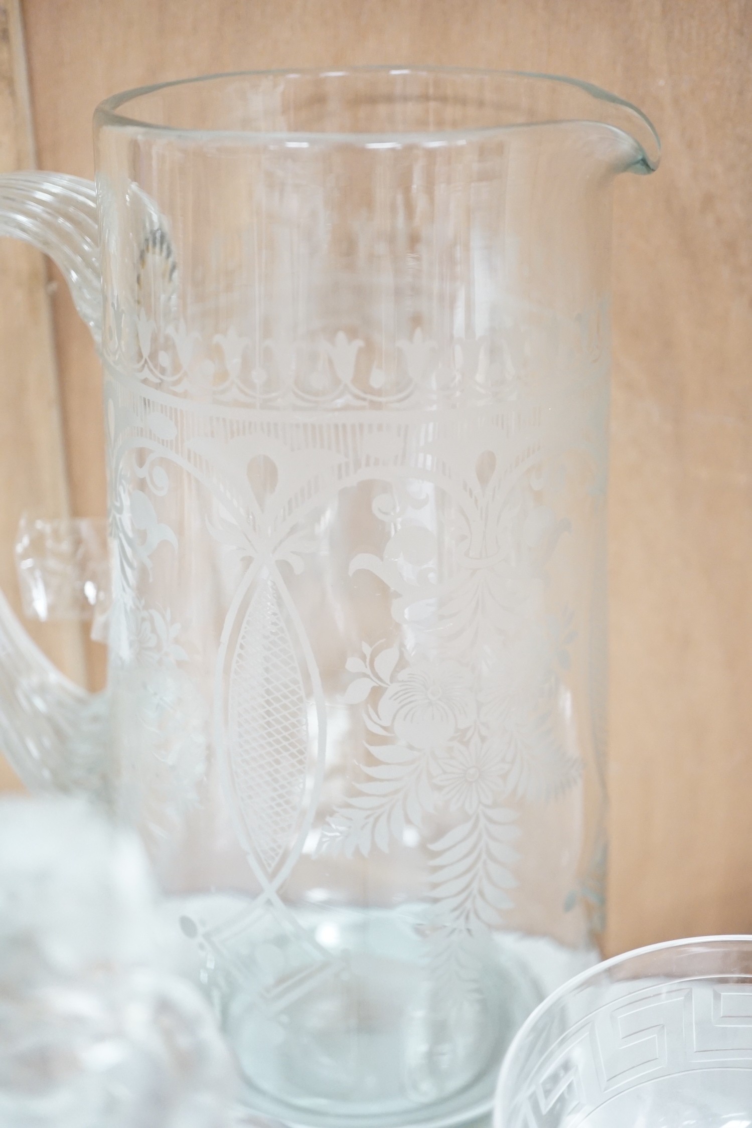 A selection of various engraved glassware, together with a cut glass decanter and stylish jug. Tallest 25cm